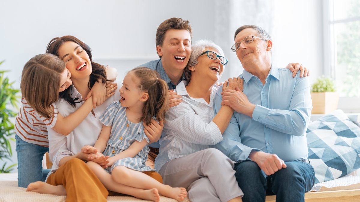 Happy multigenerational family spending time together at home, representing the peace of mind that short term health insurance can provide during unexpected health needs.